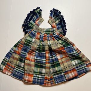 Blue, green, and orange plaid dress.